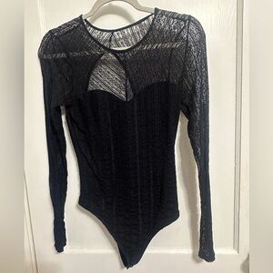 Black lace body suit with open back. Perfect for the winter season! Worn once!